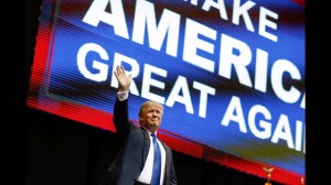 Republican presidential candidate, businessman Donald Trump waves has he arrives for a campaign rally Monday, Feb. 8, 2016, in Manchester, N.H. (AP Photo/David Goldman)